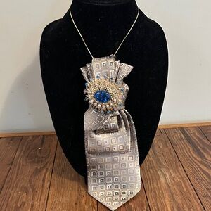 Vintage silk Geometric Patterned Tie with  vintage Blue Gem brooch on gold tone